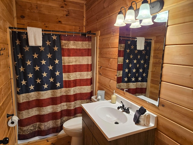 21760 State Route 93, Logan, OH 43138 - full bath featuring wooden walls, vanity, toilet, a chandelier, and curtained shower