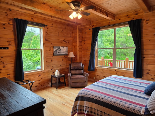 21760 State Route 93, Logan, OH 43138 - bedroom with wood finished floors, wooden walls, and wooden ceiling with exposed beams