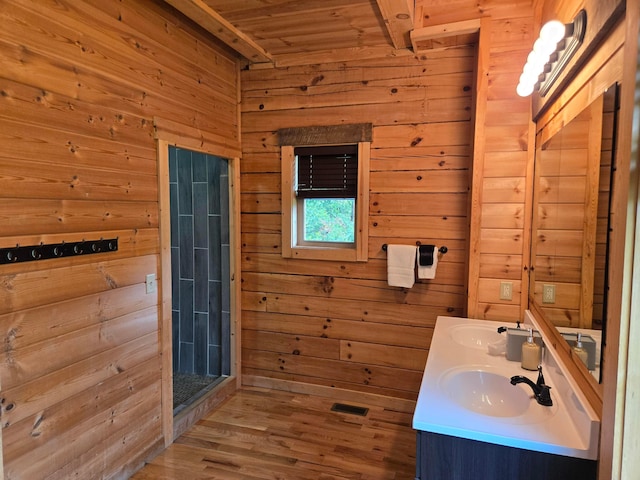 21760 State Route 93, Logan, OH 43138 - bathroom with wood walls, double vanity, wood ceiling, and wood finished floors