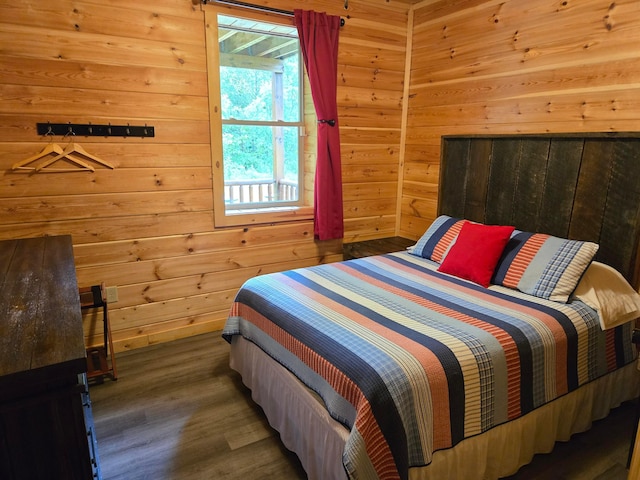21760 State Route 93, Logan, OH 43138 - bedroom featuring wooden walls and wood finished floors