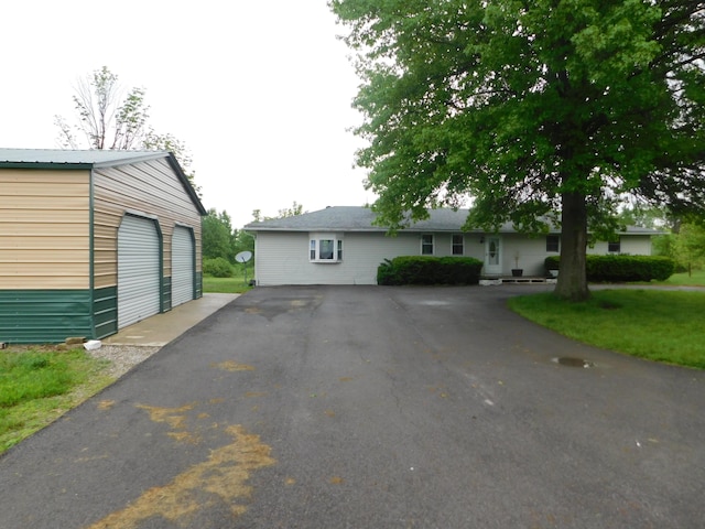 21800 State Route 47, West Mansfield, OH 43358 - view of front of home with an outdoor structure and a detached garage
