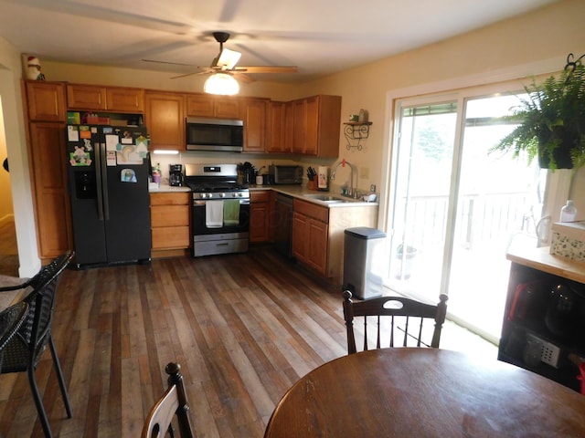21800 State Route 47, West Mansfield, OH 43358 - kitchen with appliances with stainless steel finishes, light countertops, a sink, and ceiling fan