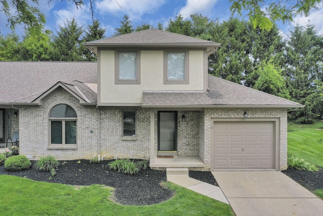 4832 Bay Grove Ct, Groveport, OH 43125 - view of front of property featuring an attached garage, a shingled roof, concrete driveway, and brick siding