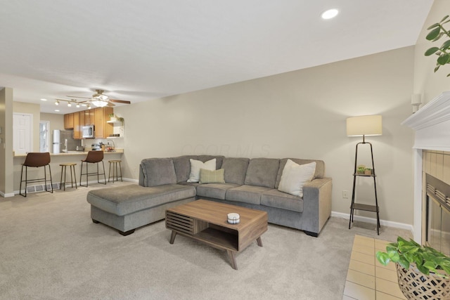 4832 Bay Grove Ct, Groveport, OH 43125 - living room with light colored carpet, a fireplace, baseboards, a ceiling fan, and recessed lighting