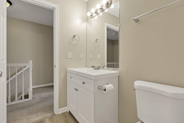 4832 Bay Grove Ct, Groveport, OH 43125 - half bathroom with toilet, vanity, and wood finished floors