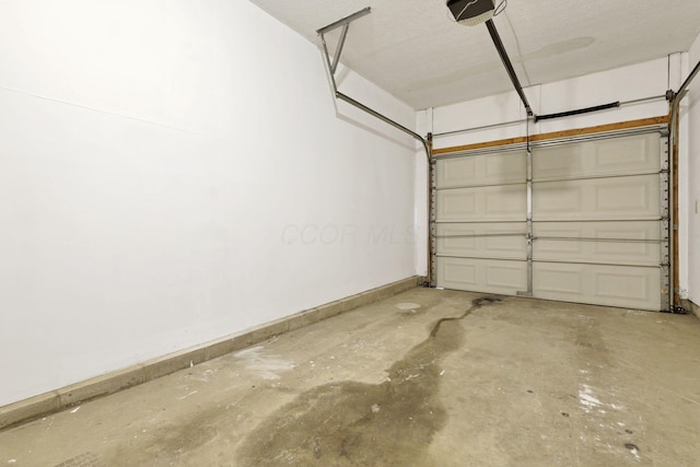 4832 Bay Grove Ct, Groveport, OH 43125 - garage featuring a garage door opener and baseboards