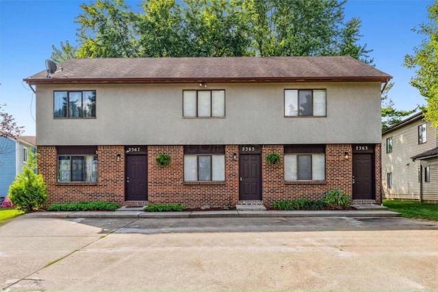 2363 Hampstead Dr Unit 2363-65-67, Columbus, OH 43229 - multi unit property with stucco siding, brick siding, and a shingled roof