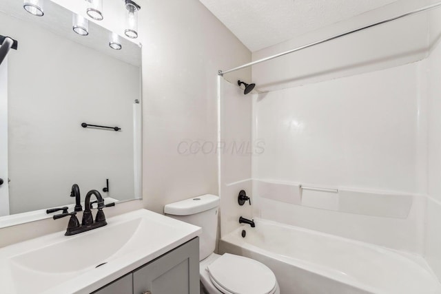 2363 Hampstead Dr Unit 2363-65-67, Columbus, OH 43229 - full bathroom featuring toilet, bathing tub / shower combination, vanity, and a textured ceiling