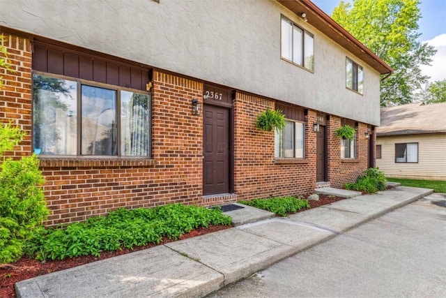 2363 Hampstead Dr Unit 2363-65-67, Columbus, OH 43229 - property entrance with brick siding and stucco siding