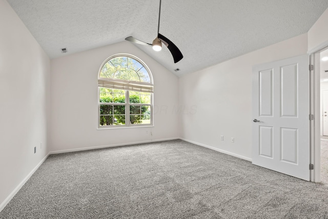 143 Falls Peak Ln, Delaware, OH 43015 - carpeted spare room with a ceiling fan, a textured ceiling, vaulted ceiling, and baseboards