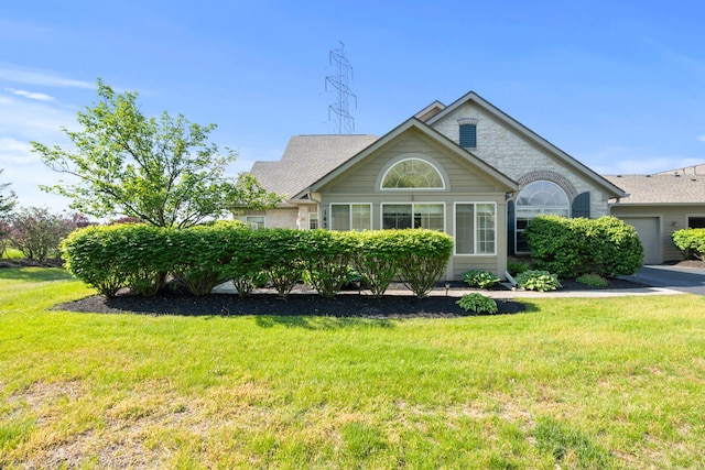 143 Falls Peak Ln, Delaware, OH 43015 - view of front of property with a front lawn and a garage