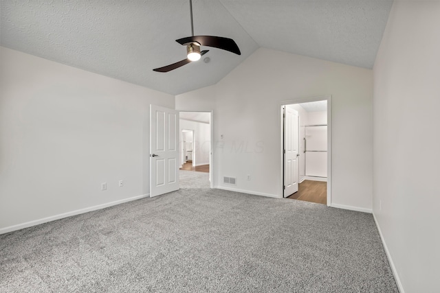 143 Falls Peak Ln, Delaware, OH 43015 - unfurnished bedroom featuring carpet floors, lofted ceiling, baseboards, a textured ceiling, and a ceiling fan