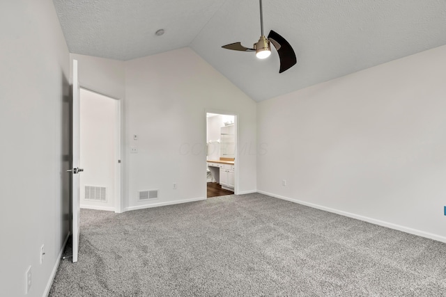 143 Falls Peak Ln, Delaware, OH 43015 - unfurnished bedroom featuring dark carpet, lofted ceiling, baseboards, connected bathroom, and ceiling fan