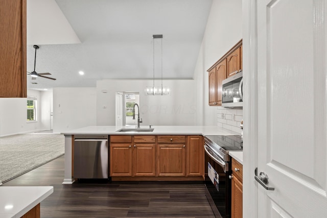 143 Falls Peak Ln, Delaware, OH 43015 - kitchen featuring stainless steel appliances, a sink, a peninsula, plenty of natural light, and recessed lighting