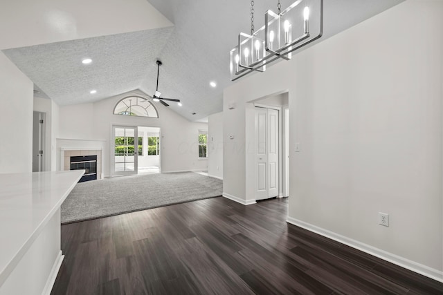 143 Falls Peak Ln, Delaware, OH 43015 - unfurnished living room with dark wood finished floors, ceiling fan, a tile fireplace, baseboards, and recessed lighting