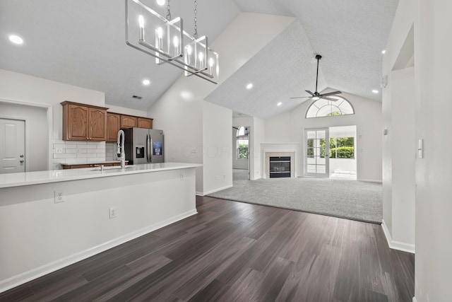 143 Falls Peak Ln, Delaware, OH 43015 - kitchen featuring stainless steel refrigerator with ice dispenser, a ceiling fan, light countertops, dark wood finished floors, and brown cabinetry