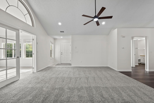 143 Falls Peak Ln, Delaware, OH 43015 - unfurnished living room with carpet, ceiling fan, recessed lighting, baseboards, and a textured ceiling