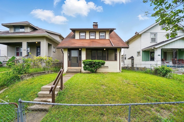 1146 Walters St, Columbus, OH 43201 - view of front of home with a chimney and a porch