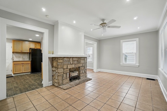 1146 Walters St, Columbus, OH 43201 - unfurnished living room featuring ceiling fan, plenty of natural light, crown molding, recessed lighting, and baseboards