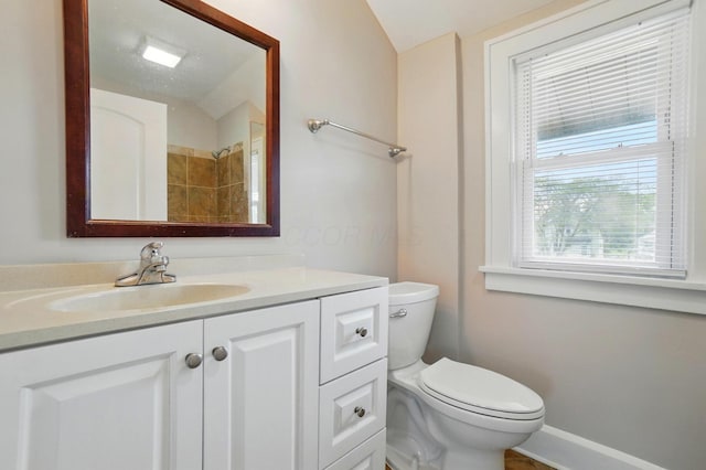 1146 Walters St, Columbus, OH 43201 - bathroom featuring toilet, vanity, baseboards, and a shower