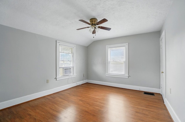 1146 Walters St, Columbus, OH 43201 - unfurnished room with a ceiling fan, healthy amount of natural light, wood finished floors, a textured ceiling, and baseboards