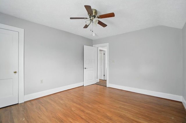 1146 Walters St, Columbus, OH 43201 - unfurnished bedroom with wood finished floors, baseboards, ceiling fan, and a textured ceiling