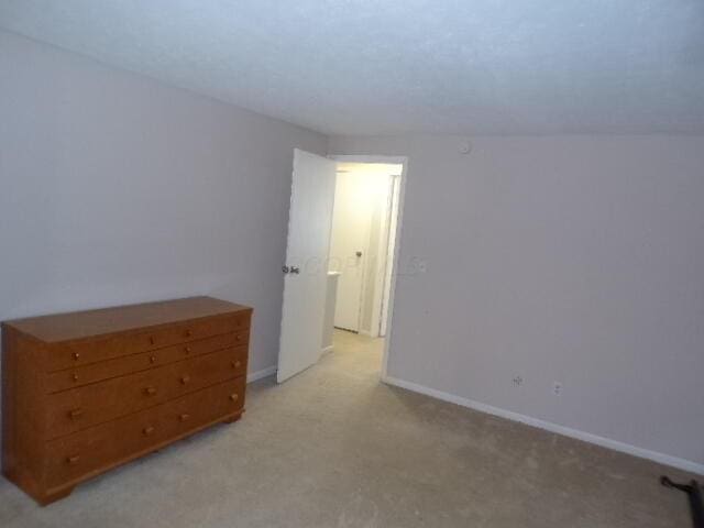 1022 Galliton Ct Unit C, Columbus, OH 43220 - unfurnished bedroom with light carpet and baseboards