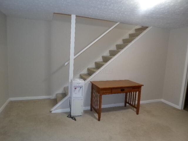 1022 Galliton Ct Unit C, Columbus, OH 43220 - finished basement featuring stairway, light colored carpet, a textured ceiling, and baseboards