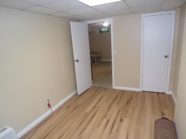 1022 Galliton Ct Unit C, Columbus, OH 43220 - unfurnished bedroom featuring light wood-style floors, baseboards, and a paneled ceiling