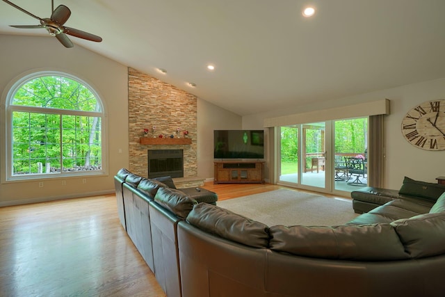 1494 Old Carriage Ct, Canal Winchester, OH 43110 - living room with healthy amount of natural light, a fireplace, light wood-style floors, a ceiling fan, and high vaulted ceiling