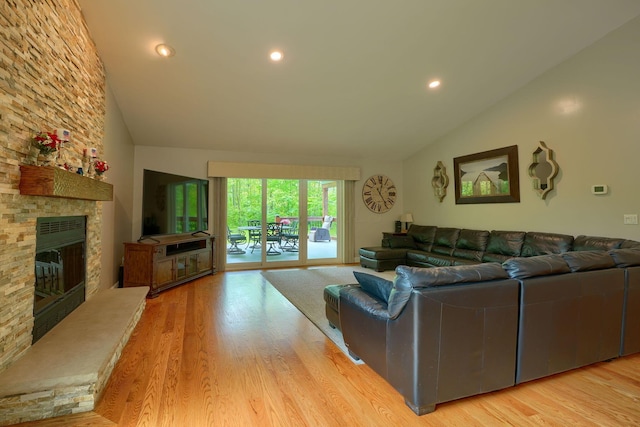 1494 Old Carriage Ct, Canal Winchester, OH 43110 - living area featuring vaulted ceiling, wood finished floors, a fireplace, and recessed lighting