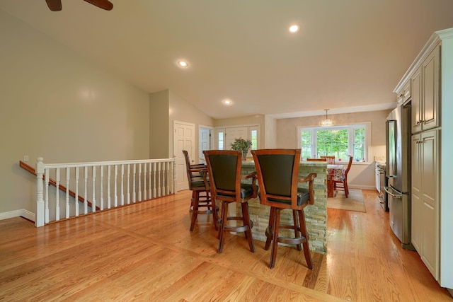 1494 Old Carriage Ct, Canal Winchester, OH 43110 - dining space featuring baseboards, light wood-type flooring, recessed lighting, lofted ceiling, and ceiling fan