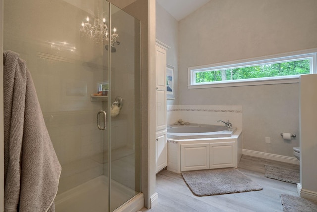 1494 Old Carriage Ct, Canal Winchester, OH 43110 - full bath featuring wood finished floors, a shower stall, a garden tub, toilet, and baseboards