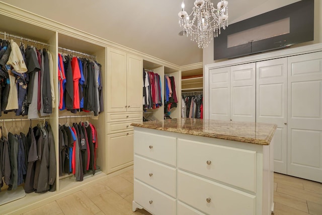 1494 Old Carriage Ct, Canal Winchester, OH 43110 - spacious closet with vaulted ceiling and a chandelier