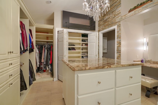 1494 Old Carriage Ct, Canal Winchester, OH 43110 - walk in closet with a chandelier and light tile patterned floors