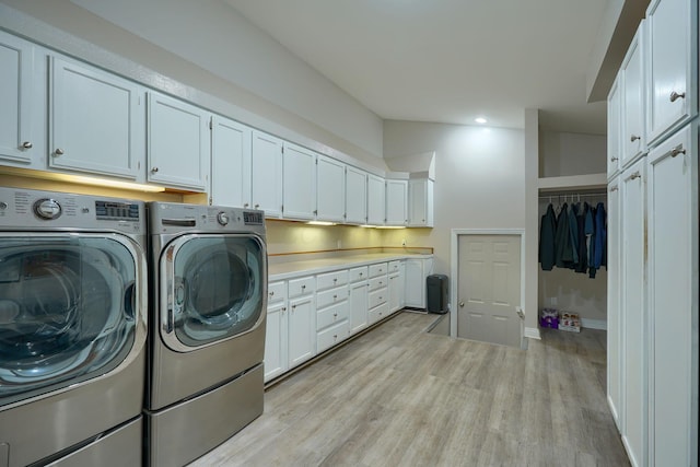 1494 Old Carriage Ct, Canal Winchester, OH 43110 - laundry room featuring washing machine and dryer, light wood-style flooring, cabinet space, baseboards, and recessed lighting