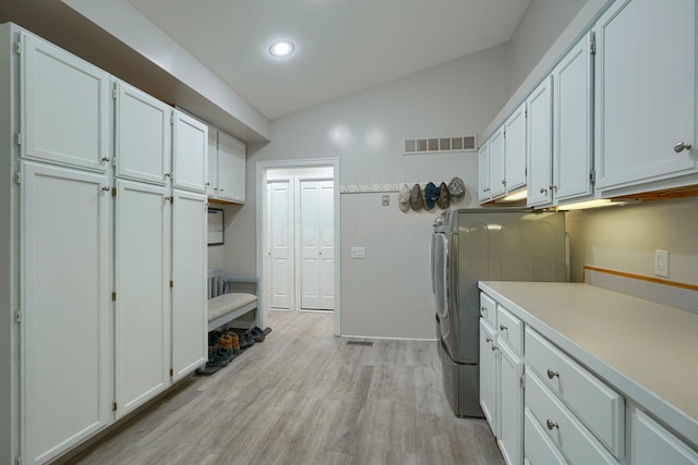 1494 Old Carriage Ct, Canal Winchester, OH 43110 - washroom featuring cabinet space, washer and dryer, light wood-style flooring, and recessed lighting