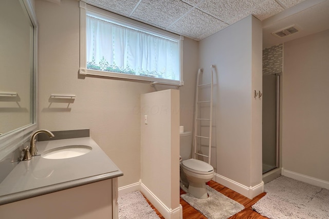 1494 Old Carriage Ct, Canal Winchester, OH 43110 - full bathroom with toilet, vanity, wood finished floors, a shower with shower door, and baseboards