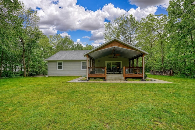 1494 Old Carriage Ct, Canal Winchester, OH 43110 - back of property featuring a ceiling fan, a wooden deck, and a lawn