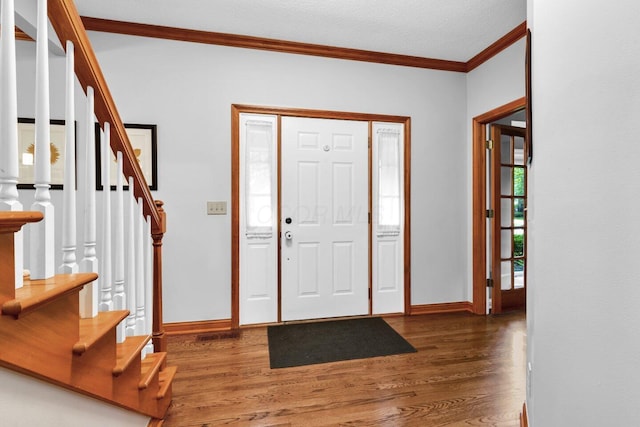 5528 Cypress Ct, Westerville, OH 43082 - entrance foyer featuring crown molding, wood finished floors, baseboards, and stairs