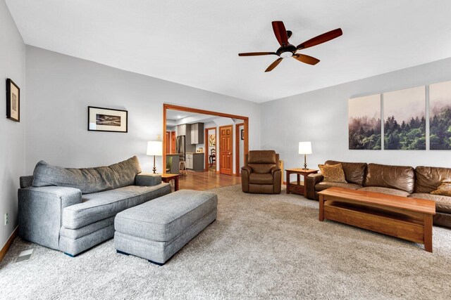 5528 Cypress Ct, Westerville, OH 43082 - carpeted living room featuring a ceiling fan and baseboards