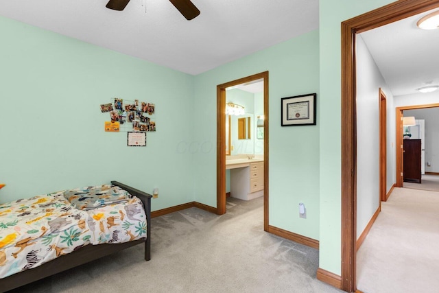 5528 Cypress Ct, Westerville, OH 43082 - bedroom featuring light carpet, baseboards, connected bathroom, and a ceiling fan