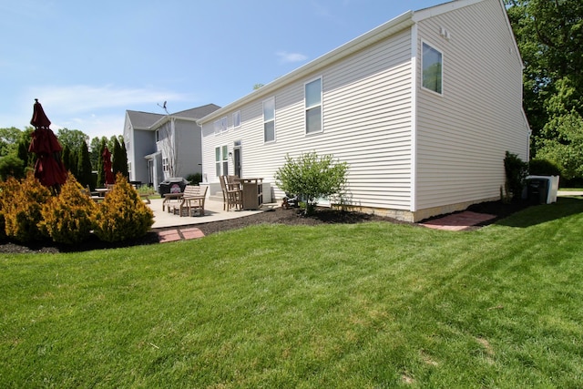 5933 Lakemont Dr, Westerville, OH 43081 - back of property featuring a patio area and a lawn