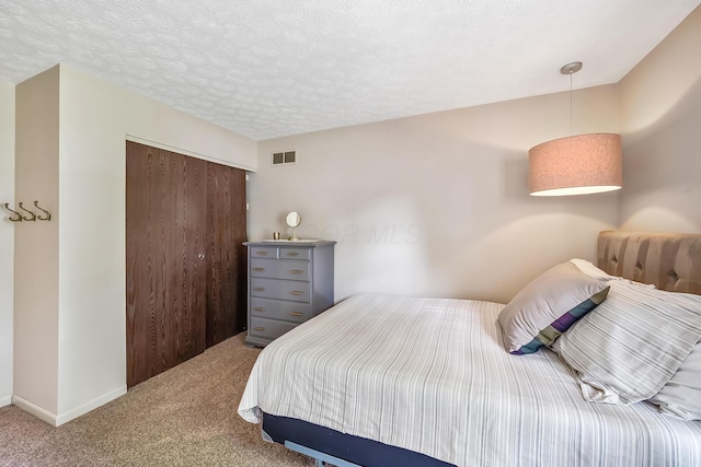 590 Haversham Dr, Gahanna, OH 43230 - carpeted bedroom with a closet and a textured ceiling