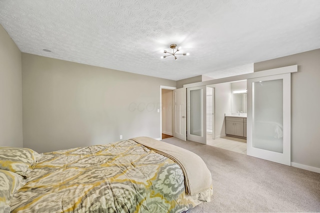 590 Haversham Dr, Gahanna, OH 43230 - bedroom with light carpet, french doors, connected bathroom, and a textured ceiling