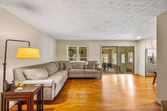 590 Haversham Dr, Gahanna, OH 43230 - living room featuring light wood finished floors, a textured ceiling, and recessed lighting