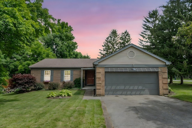 590 Haversham Dr, Gahanna, OH 43230 - single story home featuring brick siding, concrete driveway, a garage, and a lawn