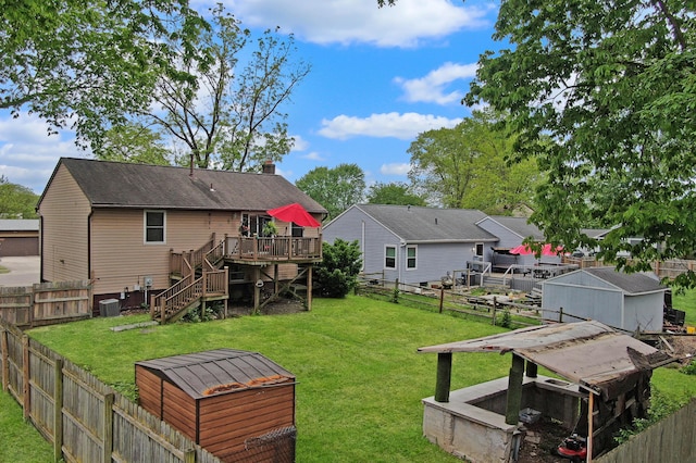 6024 Winterberry Dr, Galloway, OH 43119 - rear view of property featuring a deck, stairway, and a chimney