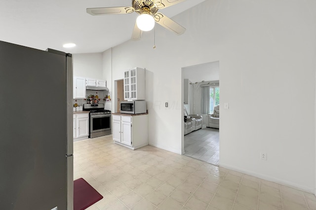 6024 Winterberry Dr, Galloway, OH 43119 - kitchen with stainless steel appliances, ceiling fan, white cabinetry, a towering ceiling, and light flooring