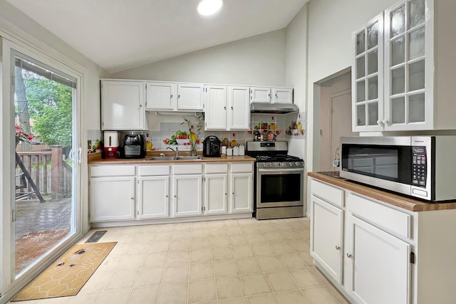 6024 Winterberry Dr, Galloway, OH 43119 - kitchen with appliances with stainless steel finishes, lofted ceiling, under cabinet range hood, a sink, and white cabinetry